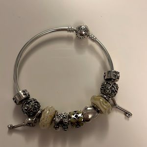 Authentic Pandora silver bangle with 11 Chamilia charms
